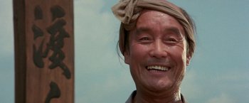 Movie still from “Lone Wolf and Cub: Baby Cart to Hades” (1972), directed by Kenji Misumi – An older man with a bandana around his head; Close Up shot, Low angle