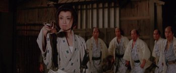 Movie still from “Lone Wolf and Cub: Baby Cart to Hades” (1972), directed by Kenji Misumi – A group of people dressed in traditional japanese garb; Medium shot, Low angle