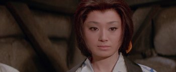 Movie still from “Lone Wolf and Cub: Baby Cart to Hades” (1972), directed by Kenji Misumi – A person wearing a white shirt; Close Up shot, Low angle