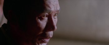 Movie still from “Lone Wolf and Cub: Baby Cart to Hades” (1972), directed by Kenji Misumi – An older man looking into the distance with his eyes wide open; Extreme Close Up shot, Low angle