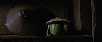 Movie still from “Lone Wolf and Cub: Baby Cart to Hades” (1972), directed by Kenji Misumi – A watermelon with a hat on it; Close Up shot, Low angle