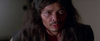 Movie still from “Lone Wolf and Cub: Baby Cart to Hades” (1972), directed by Kenji Misumi – A person with long black hair; Close Up shot, High angle