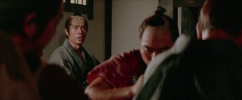 Movie still from “Lone Wolf and Cub: Baby Cart to Hades” (1972), directed by Kenji Misumi – A man and a woman are looking in a mirror; Close Up shot, Over the shoulder angle