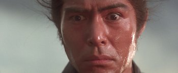 Movie still from “Lone Wolf and Cub: Baby Cart to Hades” (1972), directed by Kenji Misumi – A person's face with water on them; Extreme Close Up shot, Low angle