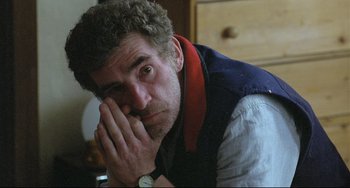 Movie still from “Looking for Eric” (2009), directed by Ken Loach – A person with his hand on his face; Close Up shot, High angle