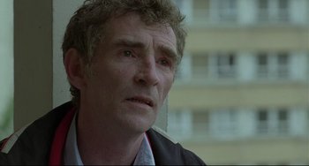 Movie still from “Looking for Eric” (2009), directed by Ken Loach – A person wearing a jacket; Close Up shot, Low angle