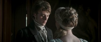 Movie still from “Lost Illusions” (2021), directed by Xavier Giannoli – A man and a woman standing next to each other; Close Up shot, Over the shoulder angle