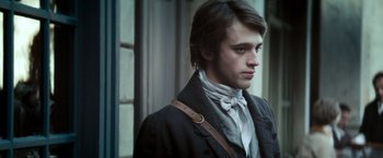 Movie still from “Lost Illusions” (2021), directed by Xavier Giannoli – A young man wearing a bow tie and a jacket; Close Up shot, Over the shoulder angle