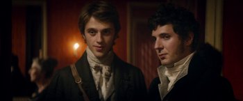 Movie still from “Lost Illusions” (2021), directed by Xavier Giannoli – Two young men dressed in period clothing pose for a picture; Close Up shot, Low angle