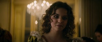 Movie still from “Lost Illusions” (2021), directed by Xavier Giannoli – A person with curly hair; Close Up shot, Over the shoulder angle