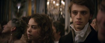 Movie still from “Lost Illusions” (2021), directed by Xavier Giannoli – A man and a woman are looking at the camera; Close Up shot, Over the shoulder angle