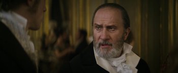 Movie still from “Lost Illusions” (2021), directed by Xavier Giannoli – An old man with a beard and a white mustache; Close Up shot, Low angle