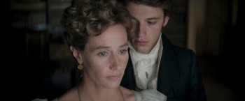 Movie still from “Lost Illusions” (2021), directed by Xavier Giannoli – A man and a woman in formal wear looking into the distance; Close Up shot, Over the shoulder angle