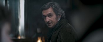 Movie still from “Lost Illusions” (2021), directed by Xavier Giannoli – A person wearing a jacket; Close Up shot, Over the shoulder angle