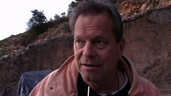 Movie still from “Lost in La Mancha” (2002), directed by Louis Pepe – A person wearing a jacket; Close Up shot, High angle