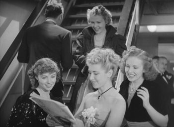 Movie still from “Love Affair” (1939), directed by Leo McCarey – A black and white photo of a group of people; Medium shot, High angle