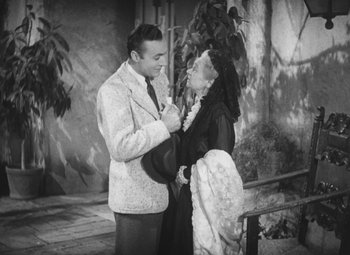 Movie still from “Love Affair” (1939), directed by Leo McCarey – A man and a woman standing next to each other; Medium shot, High angle