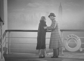 Movie still from “Love Affair” (1939), directed by Leo McCarey – An older man and woman standing on a pier; Wide shot, High angle