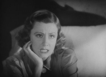 Movie still from “Love Affair” (1939), directed by Leo McCarey – An old photo of a woman looking at the camera; Close Up shot, High angle