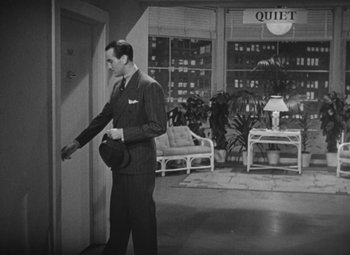 Movie still from “Love Affair” (1939), directed by Leo McCarey – A black and white photo of a man in a suit; Wide shot, High angle