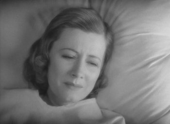 Movie still from “Love Affair” (1939), directed by Leo McCarey – An old photo of a woman laying in a bed; Close Up shot, High angle