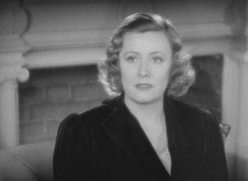 Movie still from “Love Affair” (1939), directed by Leo McCarey – An old photo of a woman in a black jacket; Close Up shot, High angle