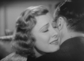 Movie still from “Love Affair” (1939), directed by Leo McCarey – An old photo of a woman and a man hugging; Close Up shot, High angle