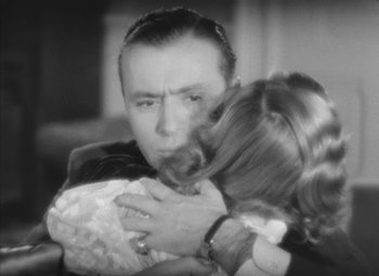 Movie still from “Love Affair” (1939), directed by Leo McCarey – A man and a woman hugging each other in a black and white photo; Close Up shot, High angle
