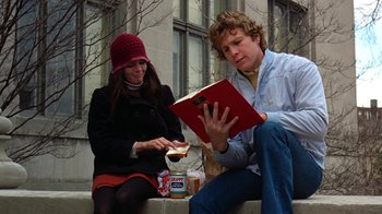 Movie still from “Love Story” (1970), directed by Arthur Hiller – A man and a woman sitting next to each other; Medium shot, Low angle