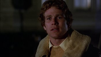 Movie still from “Love Story” (1970), directed by Arthur Hiller – A person wearing a jacket; Close Up shot, Low angle