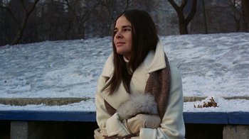 Movie still from “Love Story” (1970), directed by Arthur Hiller – A woman in a white coat and a fur stole; Medium shot, Low angle