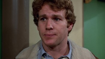 Movie still from “Love Story” (1970), directed by Arthur Hiller – A person wearing a shirt and jacket; Close Up shot, High angle