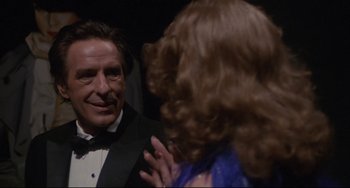 Movie still from “Love Streams” (1984), directed by John Cassavetes – A man in a tuxedo and a woman in a blue dress; Close Up shot, Over the shoulder angle