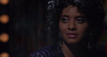 Movie still from “Love Streams” (1984), directed by John Cassavetes – A person wearing a purple shirt; Close Up shot, Over the shoulder angle