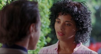 Movie still from “Love Streams” (1984), directed by John Cassavetes – A woman in a pink shirt talking to a man in a pink shirt; Close Up shot, Over the shoulder angle