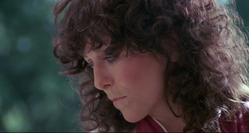 Movie still from “Love Streams” (1984), directed by John Cassavetes – A person with curly brown hair; Close Up shot, Low angle
