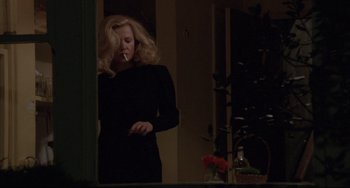 Movie still from “Love Streams” (1984), directed by John Cassavetes – A woman in a black dress is smoking a cigarette; Medium shot, Low angle