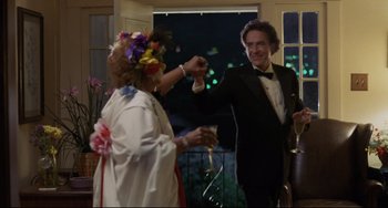 Movie still from “Love Streams” (1984), directed by John Cassavetes – A man and a woman dancing at an event; Medium shot, Low angle