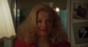 Movie still from “Love Streams” (1984), directed by John Cassavetes – A person wearing a red shirt; Close Up shot, Over the shoulder angle