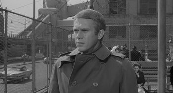 Movie still from “Love with the Proper Stranger” (1963), directed by Robert Mulligan – Black and white photograph of a man wearing a trench coat; Close Up shot, Over the shoulder angle