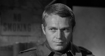 Movie still from “Love with the Proper Stranger” (1963), directed by Robert Mulligan – Black and white photograph of a man in a military uniform; Close Up shot, Over the shoulder angle