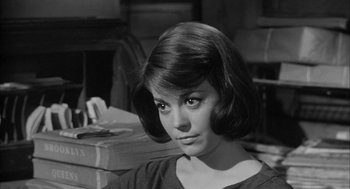 Movie still from “Love with the Proper Stranger” (1963), directed by Robert Mulligan – A black - and - white photo of a young woman with short hair; Close Up shot, High angle