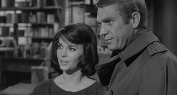 Movie still from “Love with the Proper Stranger” (1963), directed by Robert Mulligan – A man and a woman standing next to each other in a room; Close Up shot, Over the shoulder angle
