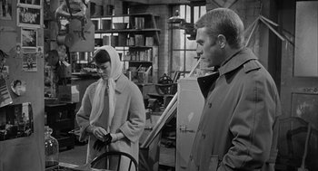 Movie still from “Love with the Proper Stranger” (1963), directed by Robert Mulligan – A man and a woman standing in a room; Medium shot, Over the shoulder angle