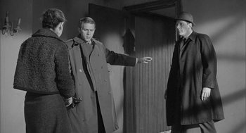 Movie still from “Love with the Proper Stranger” (1963), directed by Robert Mulligan – Two men and a woman are standing in front of a door; Medium shot, Over the shoulder angle