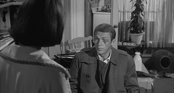 Movie still from “Love with the Proper Stranger” (1963), directed by Robert Mulligan – A black and white photo of a man and a woman; Close Up shot, Over the shoulder angle