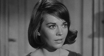 Movie still from “Love with the Proper Stranger” (1963), directed by Robert Mulligan – A black - and - white photo of a woman's face; Close Up shot, Low angle
