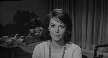 Movie still from “Love with the Proper Stranger” (1963), directed by Robert Mulligan – Black and white photograph of a woman with a necklace; Close Up shot, Over the shoulder angle