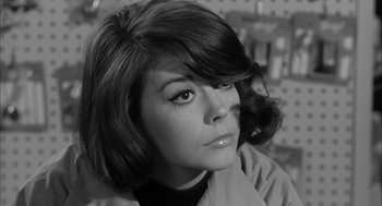 Movie still from “Love with the Proper Stranger” (1963), directed by Robert Mulligan – A black and white photo of a woman with short hair; Close Up shot, Low angle