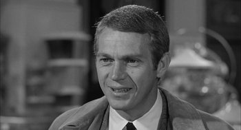 Movie still from “Love with the Proper Stranger” (1963), directed by Robert Mulligan – Black and white photograph of a man in a suit; Close Up shot, Over the shoulder angle